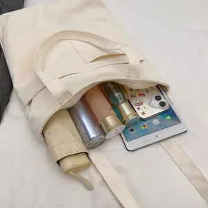 Large capacity canvas tote bag for women, casual single shoulder bag with zipper pocket.
