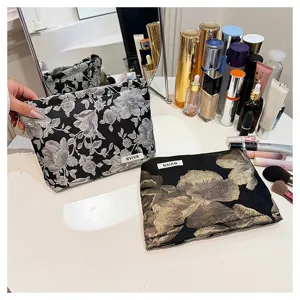 Floral jacquard cosmetic bag with large capacity, elegant cotton fabric makeup pouch for women.