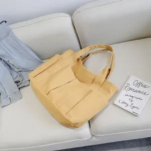 Simple Korean fashion large capacity canvas tote bag with multi pockets for women daily use.