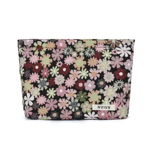 Portable floral cosmetic bag for women, cute makeup pouch and travel toiletry organizer.