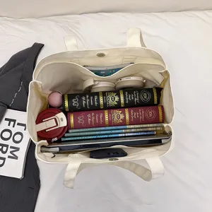 Large capacity canvas tote bag for women, casual shoulder bag for daily commute and school use.