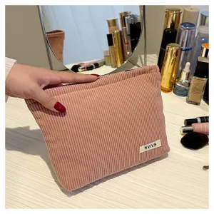 Pink corduroy cosmetic bag portable zipper pouch makeup organizer clutch storage bag.