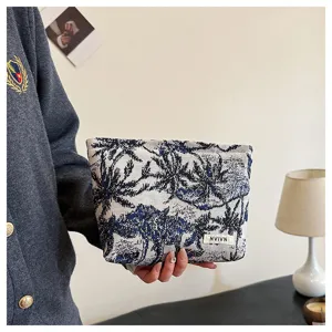 Linen cosmetic bag with blue and white pattern, versatile storage pouch for women daily use.