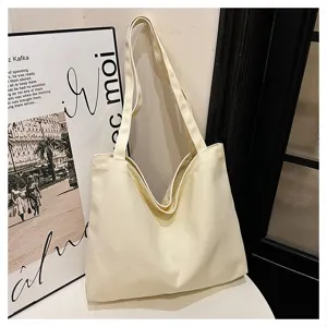 Minimalist off-white canvas tote bag for women, large capacity casual shoulder shopping bag.