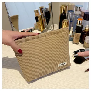 Corduroy cosmetic bag for women, solid makeup pouch, portable zipper storage bag for daily use.