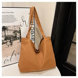 Minimalist large-capacity canvas tote bag for women, casual brown shoulder shopping bag.