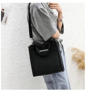 Black canvas shoulder bag, casual letter print tote, student messenger bag with top handle.