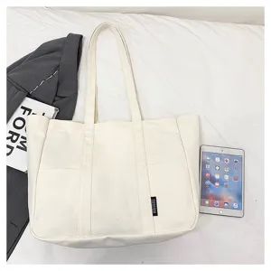 Minimalist canvas tote bag for daily use, large capacity shoulder bag for students.