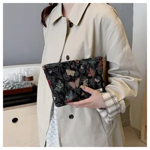 Chic Chinese style woven linen cosmetic bag detail view, featuring vibrant butterfly pattern.