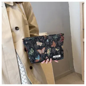 Chic Chinese style linen cosmetic bag with butterfly embroidery, perfect for daily storage use.