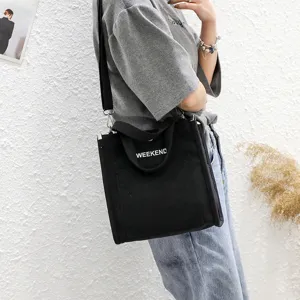 Black canvas shoulder bag with WEEKEND letter print, casual crossbody bag for daily student use.