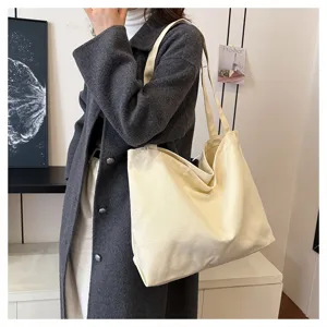 Casual minimalist canvas tote bag in off-white, large capacity daily shoulder shopping bag.