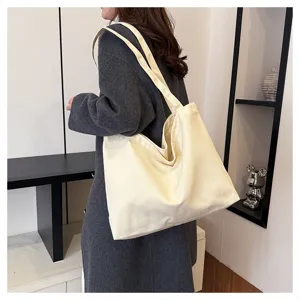 Minimalist large capacity canvas tote bag for women, comfortable shoulder daily shopping bag.