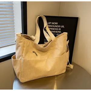 Minimalist beige corduroy shoulder tote bag, large capacity casual commuting bag detail view.