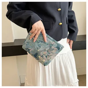 Close-up detail of the Chinese style floral linen clutch makeup bag, showing exquisite fabric texture.