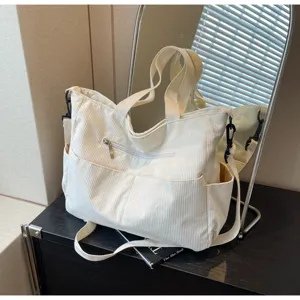Corduroy tote bag with large capacity, casual stylish shoulder bag for daily commuting.