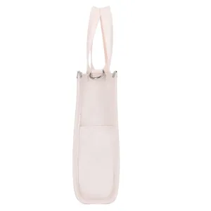 Side detail view of casual beige canvas tote bag featuring durable fabric and metal d-ring hardware.