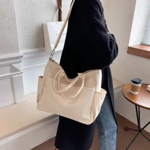 Casual beige canvas tote bag with multi-pockets, large capacity shoulder handbag for women.