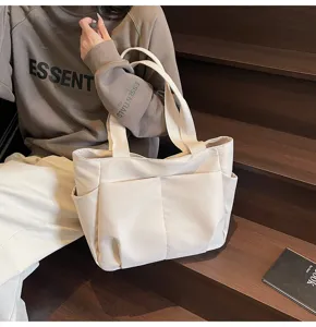 Minimalist canvas tote bag for women, solid color casual shoulder bag with front pocket.