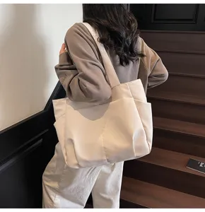 Minimalist solid color canvas tote bag with multi pockets, casual large capacity daily use.