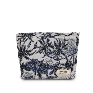 Trousse de maquillage en tissu bleu avec motif palmiers, pochette zippée portable pour voyage.