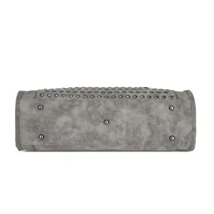 Detailed bottom view of grey frosted motorcycle tote bag showcasing metal studs and protective feet.