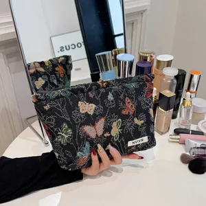 Woven tapestry cosmetic bag with colorful butterfly pattern, large capacity portable storage pouch.