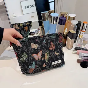 Woven makeup bag featuring colorful butterfly patterns and handy zipper closure for daily storage.