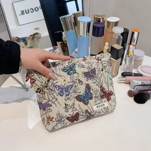 Large capacity woven cosmetic bag with elegant butterfly pattern for daily makeup storage.