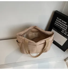 Minimalist solid canvas tote bag, versatile casual shoulder bag with multiple interior pockets.
