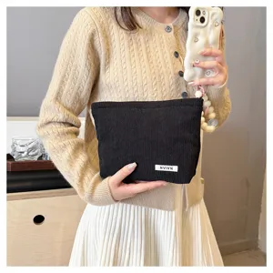 Black corduroy makeup bag minimalist solid color portable pouch for women daily cosmetic storage.