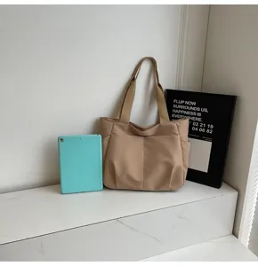Minimalist solid color canvas shoulder tote bag with front pockets for women daily commute