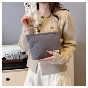 Corduroy cosmetic bag for women, solid color makeup pouch, portable storage bag for daily use.