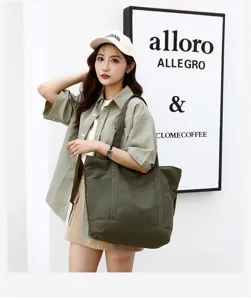 Détail de cabas en toile verte, sac à main d'épaule décontracté avec grande capacité.