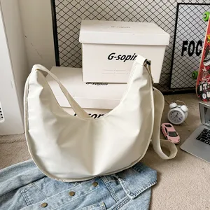 White dumpling shoulder bag, solid color crossbody tote bag for women daily casual use.