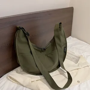 Solid color canvas hobo bag for women, casual large capacity crescent shoulder crossbody bag.
