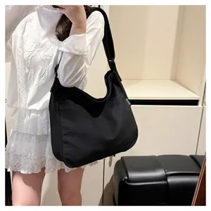 Black canvas shoulder bag for women, large capacity slouchy tote and crossbody bag for daily use.
