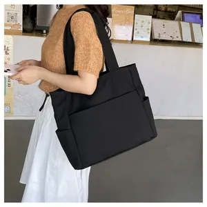 Large capacity black canvas tote bag for women, casual shoulder bag, daily commuting handbag.