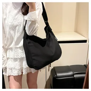 Black canvas hobo shoulder bag, casual large capacity tote for daily use and school commute.
