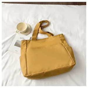 Large capacity solid canvas tote bag, minimalist daily commuter shoulder handbag for women.