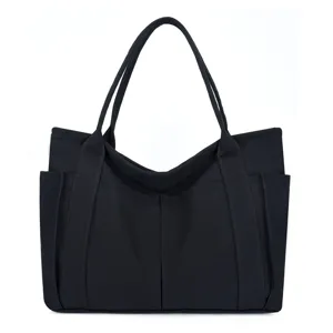 Black canvas tote bag detail view, large capacity casual daily shoulder bag design