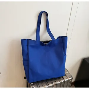 Detailed view of the royal blue canvas tote bag, perfect for daily casual use and shopping.