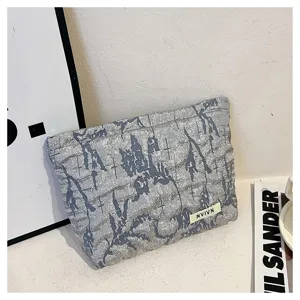 Floral pattern canvas cosmetic bag, large capacity stylish pouch, portable makeup storage clutch.