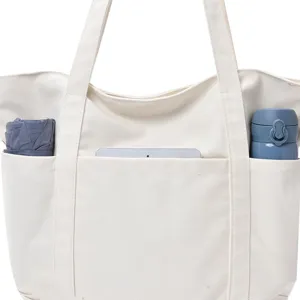 Grand sac cabas en toile blanche avec plusieurs poches exterieures pour l'usage quotidien