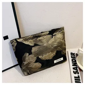 Elegant black and gold floral jacquard makeup bag, premium cotton blend clutch for women.
