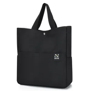Black canvas tote bag with shoulder straps, casual minimalist handbag for daily shopping use.