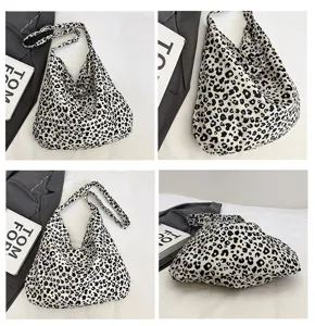 Leopard print slouchy shoulder bag detail showing soft fabric texture and spacious design.