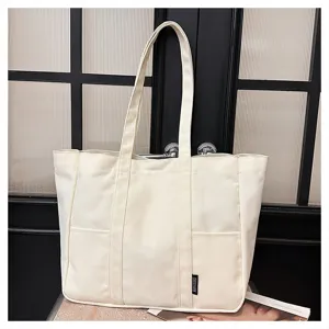 Detailed view of the casual canvas tote bag, showcasing large capacity and sturdy handles.