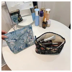 Vintage floral tapestry cosmetic bag for women, ethnic style portable makeup storage pouch.