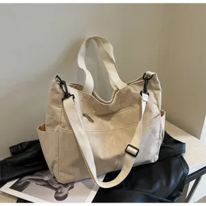 Beige corduroy tote bag for women, large capacity casual shoulder bag with zipper and strap.